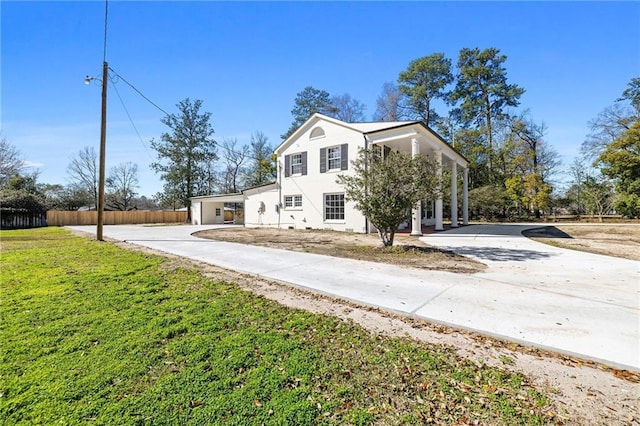 view of property exterior featuring a lawn