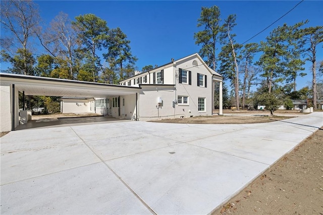 view of side of property featuring a carport