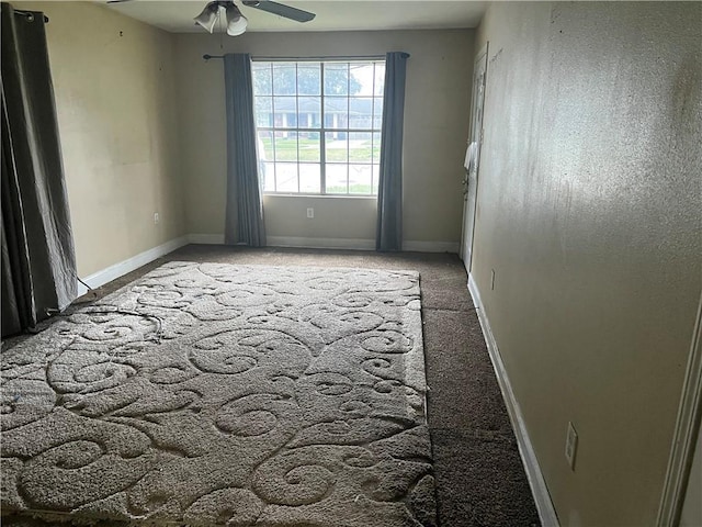 carpeted empty room with ceiling fan