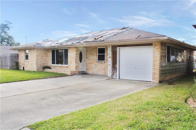 single story home featuring a garage and a front lawn