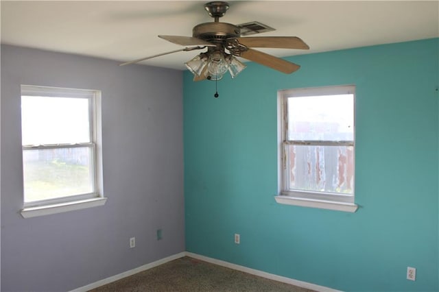 unfurnished room with carpet and ceiling fan