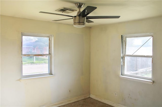 spare room with ceiling fan