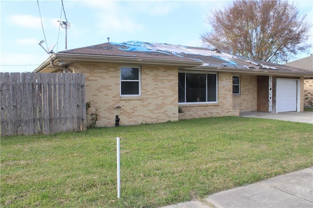 exterior space with a lawn and a garage