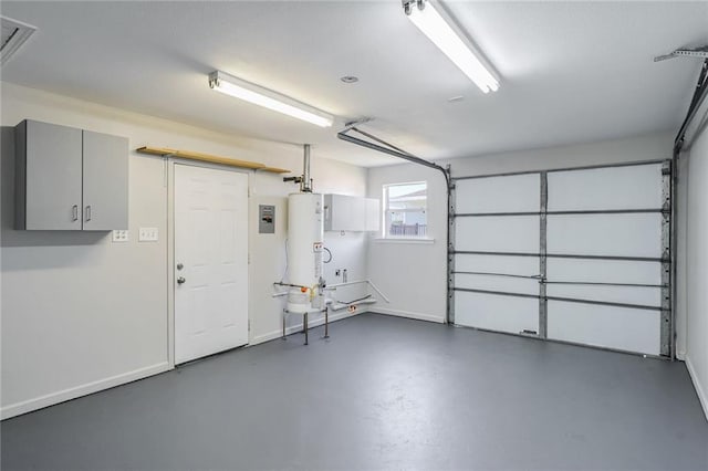 garage featuring gas water heater and electric panel