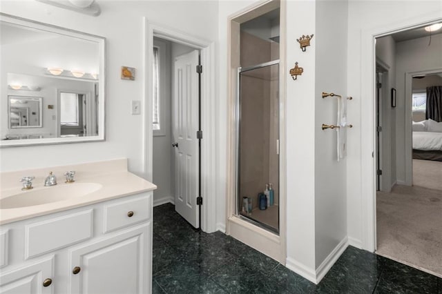 bathroom with vanity and an enclosed shower