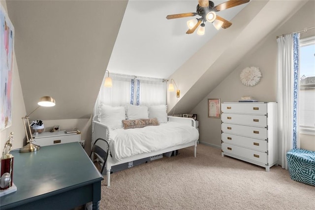 carpeted bedroom featuring vaulted ceiling and ceiling fan