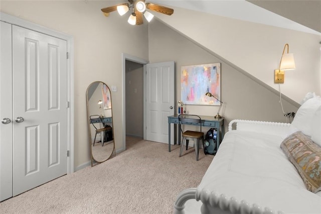 bedroom featuring ceiling fan, light colored carpet, and lofted ceiling