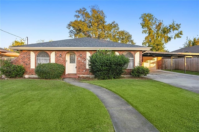 single story home with a carport and a front yard