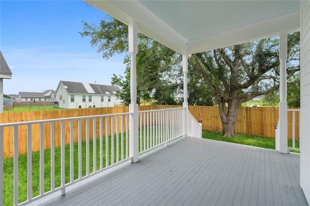 deck featuring a lawn