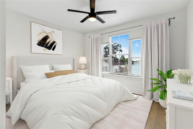 bedroom featuring hardwood / wood-style flooring and ceiling fan