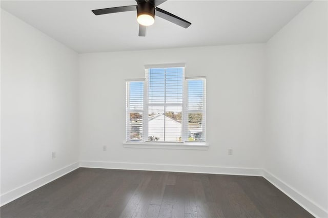 empty room featuring ceiling fan and dark hardwood / wood-style flooring