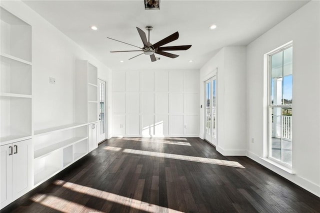 spare room featuring ceiling fan and dark hardwood / wood-style flooring