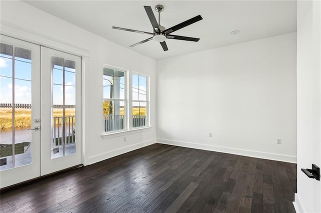 empty room featuring ceiling fan, french doors, and dark hardwood / wood-style floors