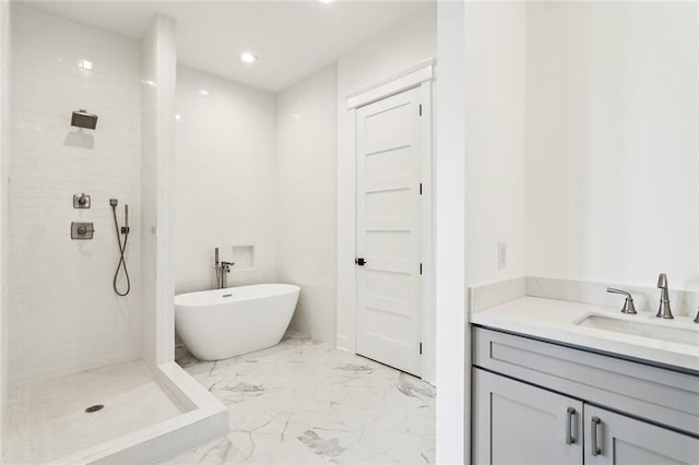 bathroom featuring vanity and shower with separate bathtub