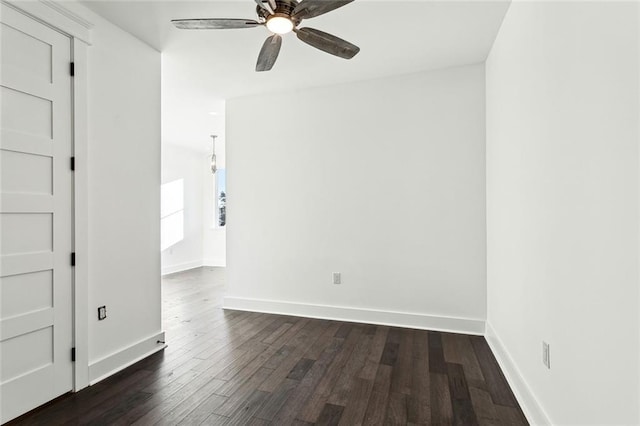 spare room featuring dark hardwood / wood-style floors and ceiling fan