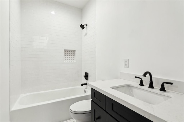 full bathroom with vanity, toilet, and tiled shower / bath combo