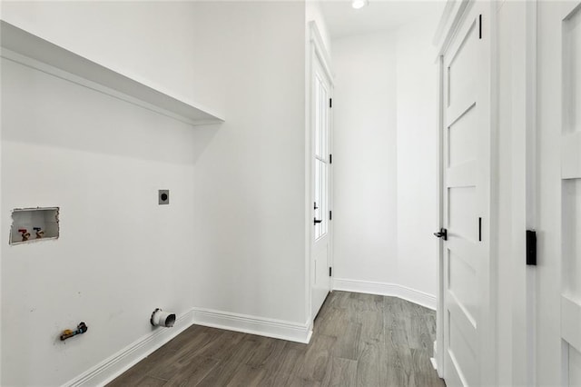 laundry area with gas dryer hookup, hardwood / wood-style floors, washer hookup, and hookup for an electric dryer