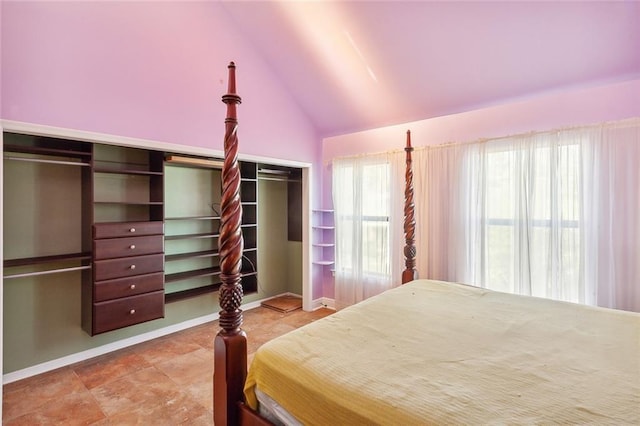 bedroom featuring a closet and lofted ceiling