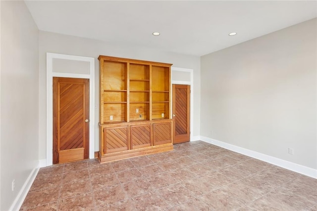 spare room with built in shelves