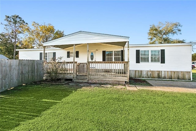 view of front of house with covered porch and a front yard