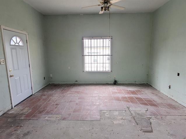 entrance foyer featuring ceiling fan