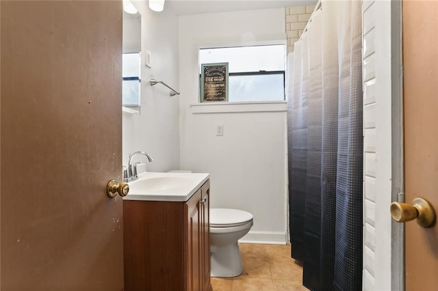 bathroom featuring tile patterned floors, vanity, and toilet