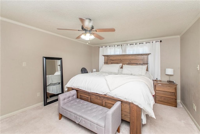 bedroom featuring light carpet, a textured ceiling, baseboards, and ornamental molding