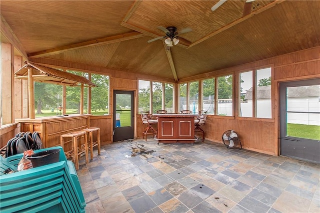 unfurnished sunroom with wooden ceiling, a ceiling fan, and lofted ceiling