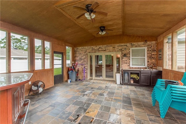 unfurnished sunroom with french doors, wood ceiling, lofted ceiling, and a sink