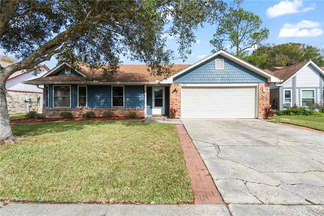 ranch-style house featuring a garage and a front lawn