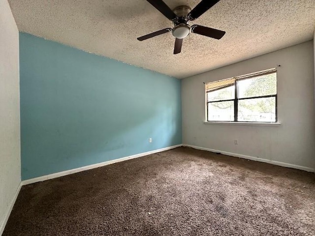 spare room featuring carpet, a textured ceiling, and ceiling fan