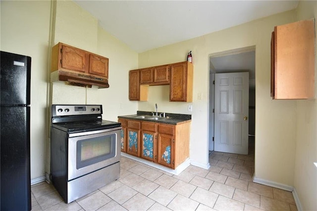 kitchen featuring black fridge, electric range, sink, and light tile patterned floors