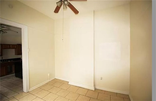 unfurnished room featuring ceiling fan and light tile patterned flooring