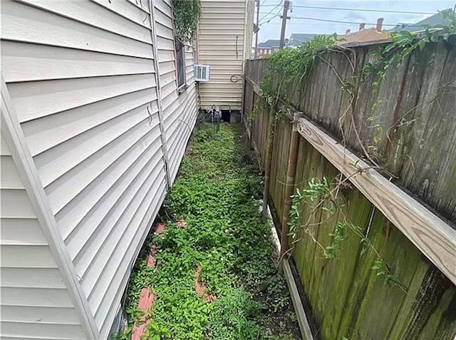 view of side of home featuring cooling unit