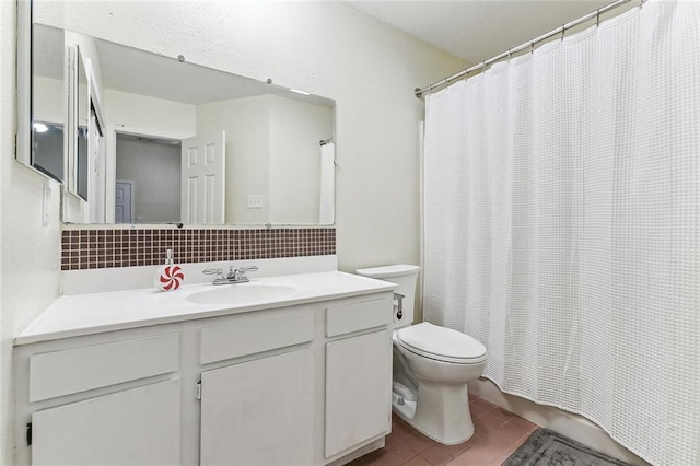 bathroom with tile patterned flooring, backsplash, toilet, a shower with shower curtain, and vanity