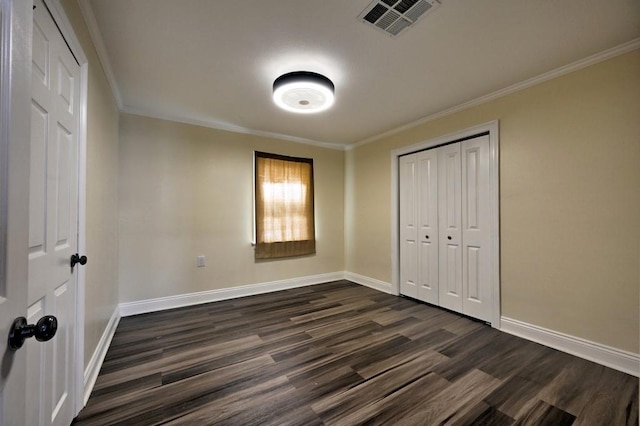 108 Pellegrin St, Chauvin, LA 70344 - unfurnished bedroom with dark hardwood / wood-style floors, a closet, and ornamental molding