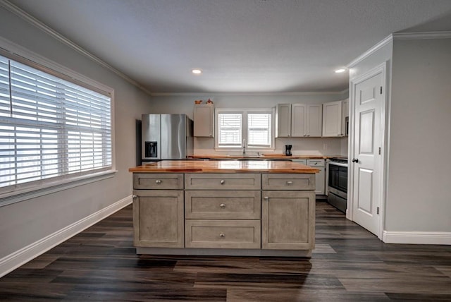 108 Pellegrin St, Chauvin, LA 70344 - kitchen featuring wooden counters, appliances with stainless steel finishes, a healthy amount of sunlight, and sink