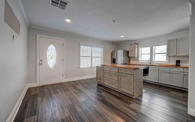 108 Pellegrin St, Chauvin, LA 70344 - kitchen featuring a wealth of natural light, stainless steel refrigerator with ice dispenser, and wood counters