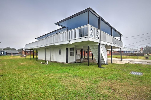 108 Pellegrin St, Chauvin, LA 70344 - rear view of house with a yard and a wooden deck