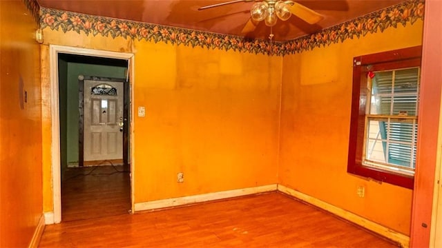 empty room featuring ceiling fan and wood-type flooring