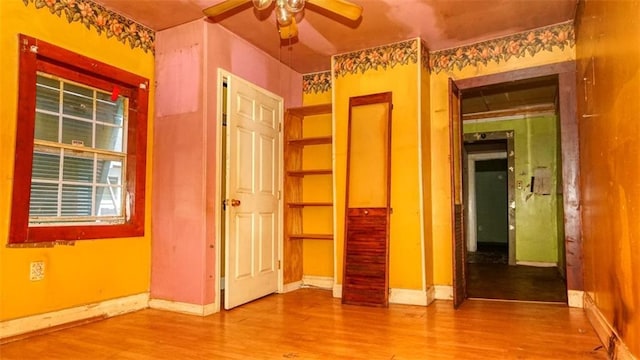 1409 Delery St, New Orleans, LA 70117 - unfurnished bedroom with wood finished floors and baseboards