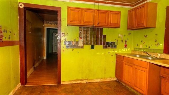 kitchen with ornamental molding and sink