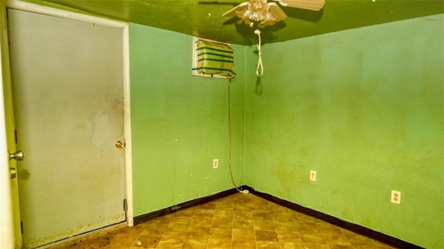 1409 Delery St, New Orleans, LA 70117 - tiled empty room with a ceiling fan and baseboards