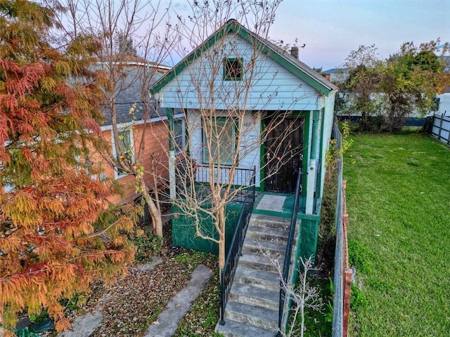 view of outbuilding with a lawn