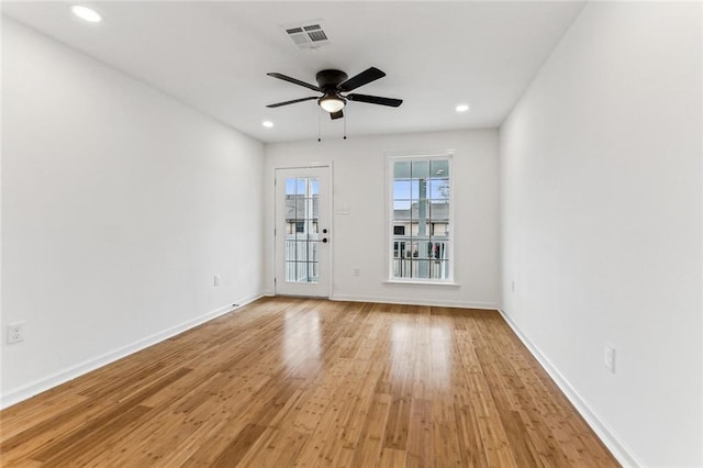 spare room featuring ceiling fan and light wood-type flooring