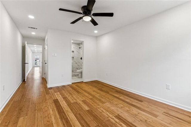 unfurnished room featuring ceiling fan and light hardwood / wood-style floors