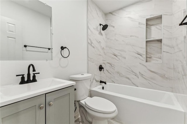 full bathroom with vanity, toilet, and tiled shower / bath