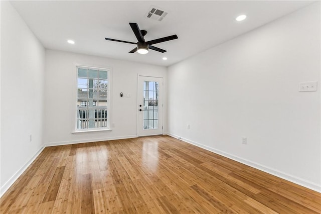 empty room featuring ceiling fan and light wood-type flooring