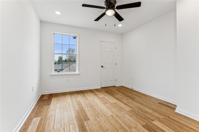 unfurnished room featuring ceiling fan and light wood-type flooring