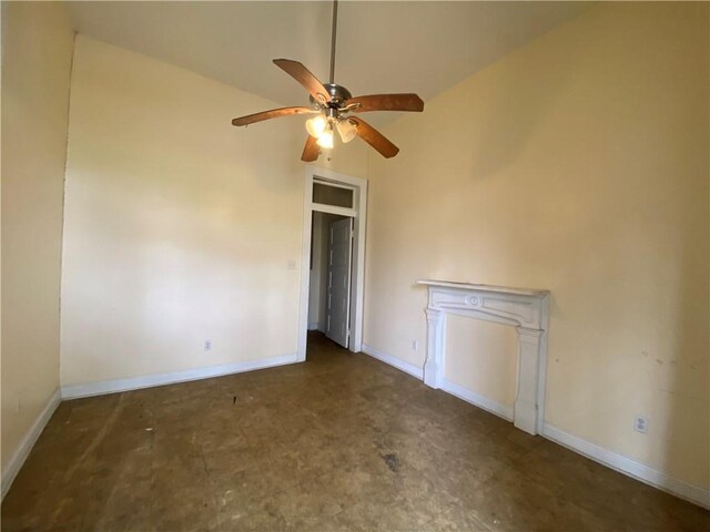 unfurnished room featuring ceiling fan and lofted ceiling